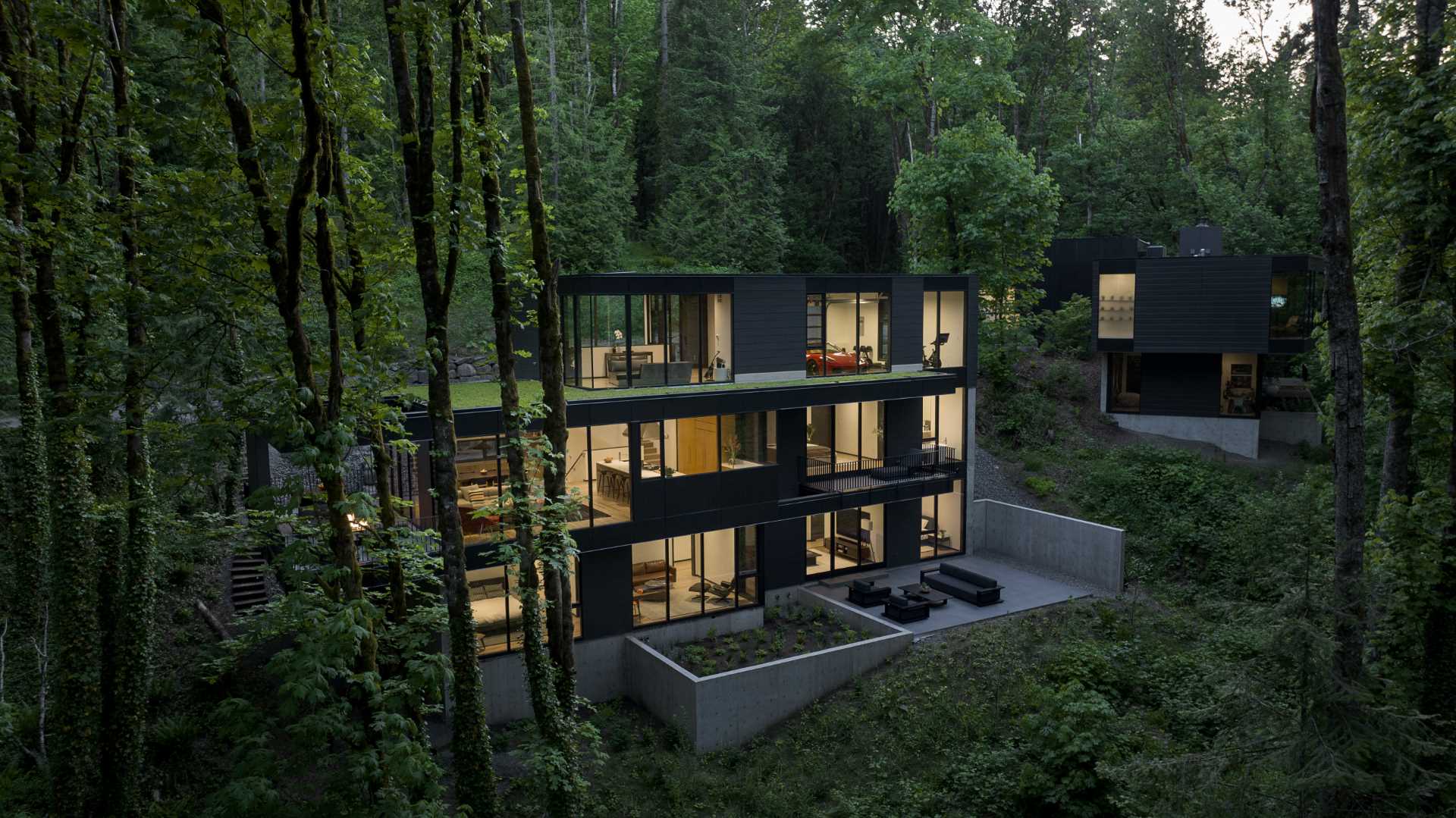 Charming cottage style house with steep roof and surrounded by greenery